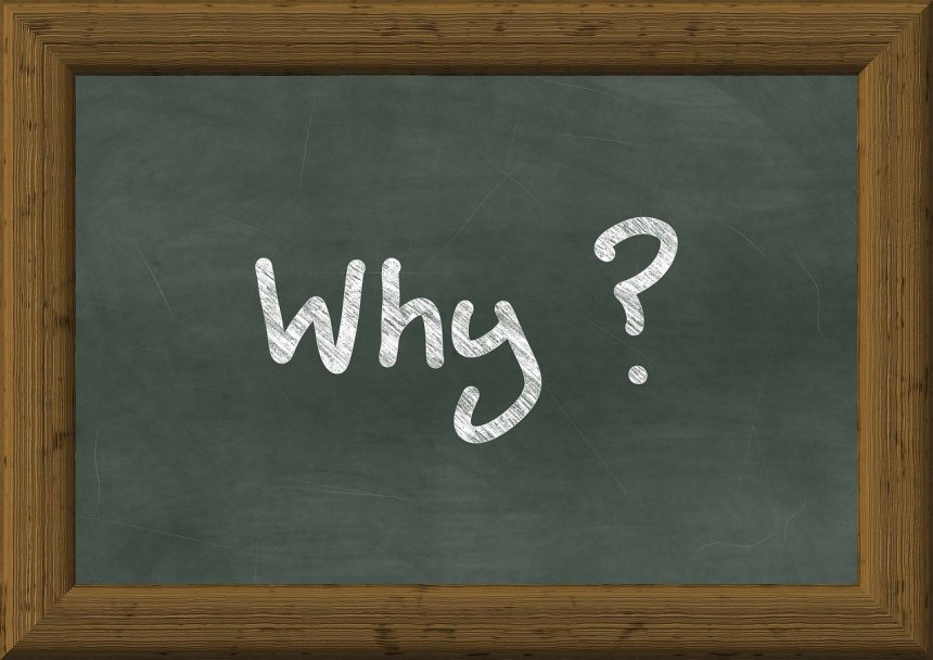 why question written on a chalk board 
