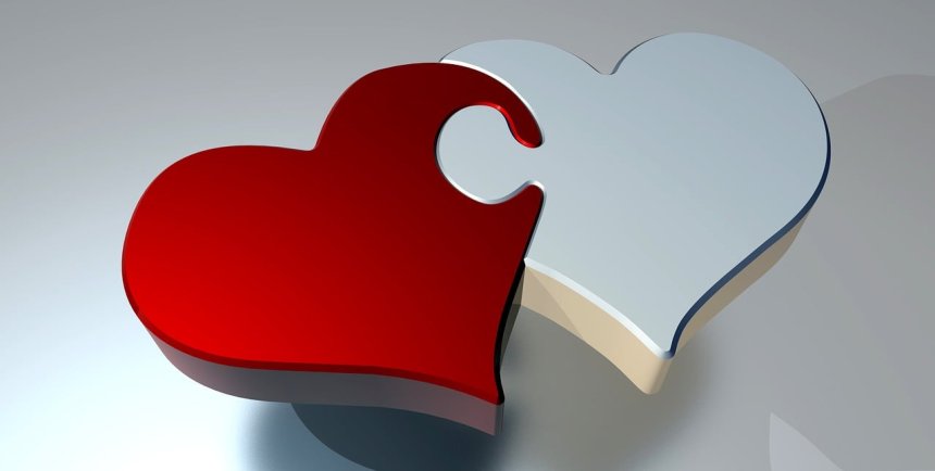 two hearts connected together like puzzle pieces