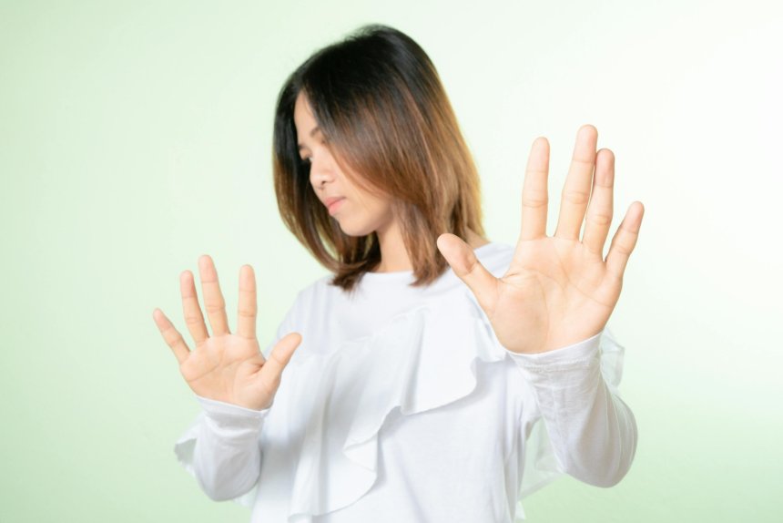 woman showing discomfort and backing away