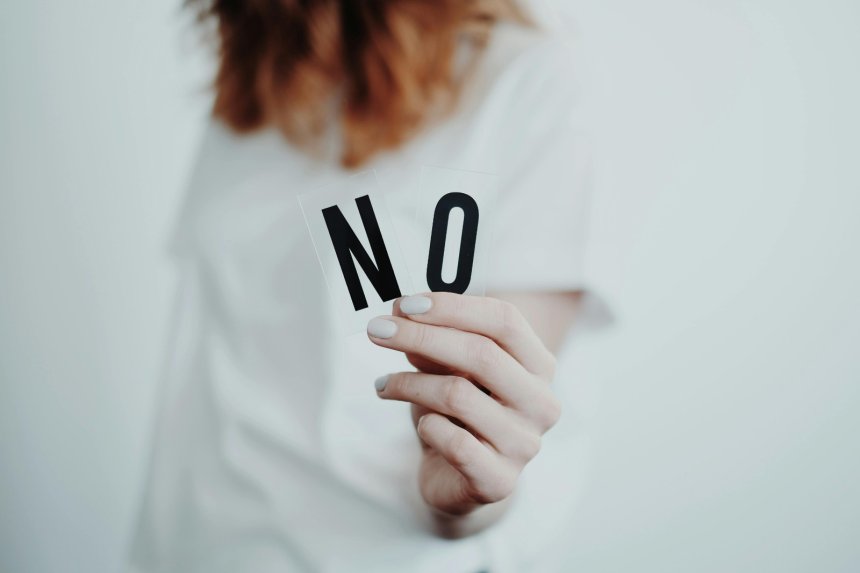 woman holding no letters