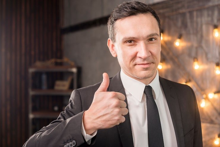man showing thumbs up in approval