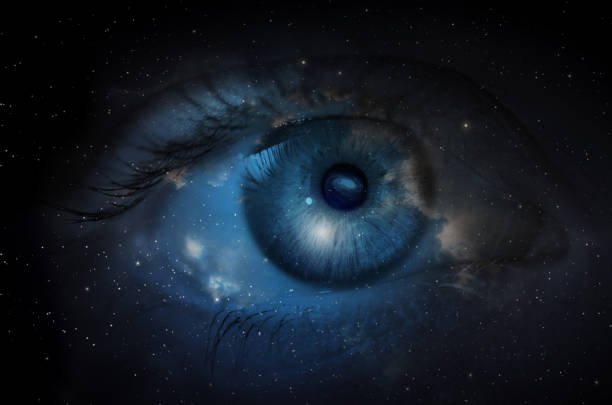 deep blue eye with a galaxy of stars around it