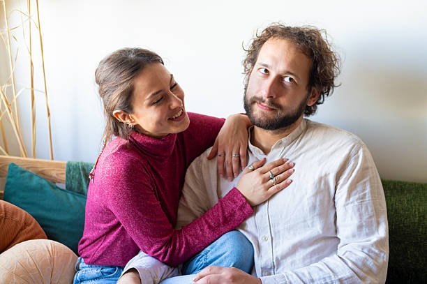 wife affirming her husband with a gentle pat on chest